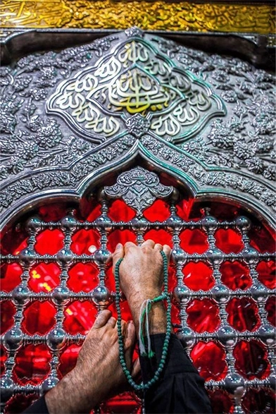 Devotee in prayer at a sacred Islamic shrine, expressing deep reverence and connection.